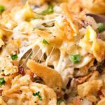 Loaded Cheesy Chicken Noodle Casserole | This chicken noodle casserole has great classic chicken noodle flavors, with some added flavors like bacon, mushrooms, and a crunchy fried onion topping!  Great for a make-ahead meal, this casserole will be family favorite! | The Chunky Chef | #chickennoodle #chickencasserole #casserole #makeahead #comfortfoods #weeknightmeals