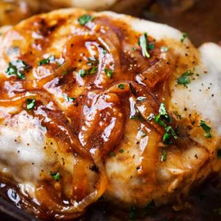 One Pan French Onion Smothered Pork Chops | Juicy pan-seared pork chops, smothered in caramelized onion sauce and 2 kinds of gooey cheese. It's easy to break out of a dinner rut with this fun weeknight meal! | The Chunky Chef | #porkchops #porkchopsrecipe #onepan #onepot #frenchonion #weeknightmeal