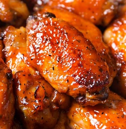 Slow Cooker Honey Buffalo Wings | Chicken wings are rubbed with spices, tossed in a sweet and spicy honey buffalo sauce, cooked in the slow cooker, then crisped up under the broiler for a finger-lickin' juicy hot wing!  Slow cooker wings are the way to go this game day season! | The Chunky Chef | #chickenwings, #hotwings #chickenwingrecipe #buffalo #honeybuffalo #slowcooker #crockpot #gamedayfood