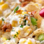 Slow Cooker Spicy Creamy Corn Dip | The easiest, creamy corn dip ever!  Toss the ingredients in the slow cooker and be amazed at how mouthwatering it tastes! | https://thechunkychef.com | #corndip #slowcooker #crockpot #appetizerrecipe #partyfood 