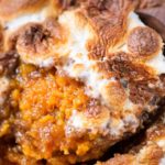 Spiced Sweet Potato Casserole | Mashed sweet potatoes are spiced with warm Fall spices, then topped with a crunchy pecan crumble and gooey marshmallows.  Perfect for Thanksgiving or any holiday! | The Chunky Chef | #sweetpotato #sweetpotatocasserole #Thanksgivingrecipe #sidedish #casserolerecipe #holidayrecipe