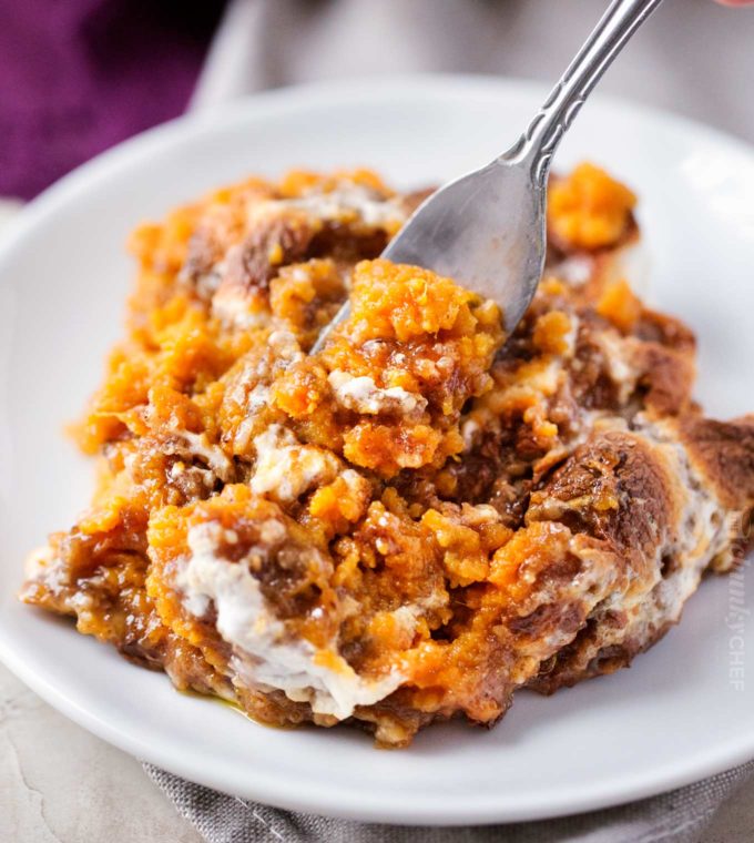 Sweet potato casserole on white plate with fork