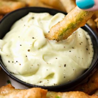 Beer Battered Fried Green Beans | The perfect appetizer or snack food, these crispy green bean "fries" are tender, crispy, yet surprisingly light thanks to the beer batter! Dipped in creamy ranch or wasabi mayo, they're a crowd-pleaser! | The Chunky Chef | #partyfood #appetizer #greenbeans #friedgreenbeans #greenbeanfries #beerbattered