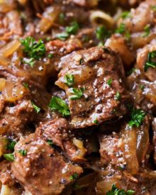 Drunken Slow Cooker Beef Stew (Beef Carbonnade) | Belgium comfort food, made easy in the slow cooker! Beef stew made with plenty of sweet onions, herbs and beer... perfect over egg noodles, mashed potatoes, or with a crusty piece of bread! | The Chunky Chef | #beefcarbonnade #beefstew #comfortfoodrecipe #slowcookerrecipes #crockpotrecipes #crockpotbeefrecipes