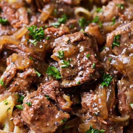 Drunken Slow Cooker Beef Stew (Beef Carbonnade) | Belgium comfort food, made easy in the slow cooker!  Beef stew made with plenty of sweet onions, herbs and beer... perfect over egg noodles, mashed potatoes, or with a crusty piece of bread! | The Chunky Chef | #beefcarbonnade #beefstew #comfortfoodrecipe #slowcookerrecipes #crockpotrecipes #crockpotbeefrecipes