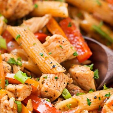 This One Pot Chicken Fajita Pasta is so creamy and flavorful, and is ready in less than 30 minutes!  Tender chicken, crisp veggies, and tender pasta smothered in a spicy, creamy sauce!  Click the photo for the full post!