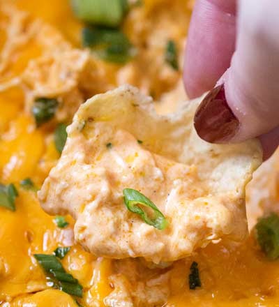 Slow Cooker Buffalo Chicken Dip Recipe | Classic buffalo wing flavors in an easy dip made in the crockpot. Perfect for a party, serve it up with chips or celery sticks and watch everyone go back for seconds!