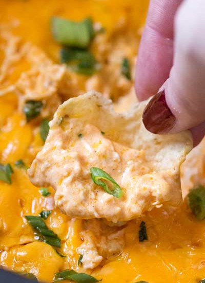 Slow Cooker Buffalo Chicken Dip Recipe | Classic buffalo wing flavors in an easy dip made in the crockpot. Perfect for a party, serve it up with chips or celery sticks and watch everyone go back for seconds!