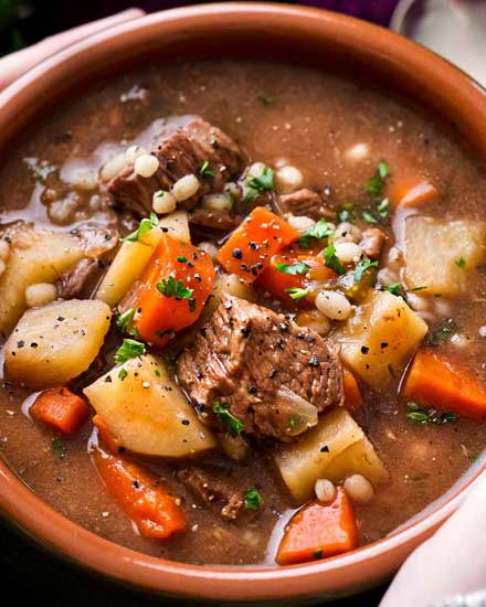 Hearty and positively soul-warming, this beef barley soup simmers all day in the slow cooker, which makes for an incredibly rich soup recipe! #beefbarley #soup #slowcooker #crockpot #comfortfood #barley #beefsoup #easyrecipe #dinner