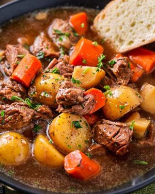 This crockpot beef stew simmers all day to create the most hearty, comforting and flavorful beef stew of all time! The flavors are enhanced by using beer and finishing the dish with a kick of horseradish #beefstew #beefstewrecipe #slowcookerbeefstew #crockpot #slowcooker #comfortfood #easyrecipe