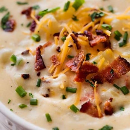 Skinny Slow Cooker Potato Soup | Thick, creamy and rich, yet surprisingly low in calories!  This lightened up version of the ultimate comfort food is perfect for warming you up on a cold night! | The Chunky Chef | #potatosoup #souprecipe #loadedpotato #slowcookerrecipes #crockpot