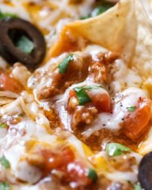Ultimate Slow Cooker Taco Dip | This taco dip is party and game-day ready, and needs only 10 minutes of prep before going in your slow cooker! Great taco flavors, and you can easily swap out the beef for ground turkey to lighten it up! | The Chunky Chef | #tacodip #gamedayrecipes #partyfood #easyappetizer #appetizerrecipes