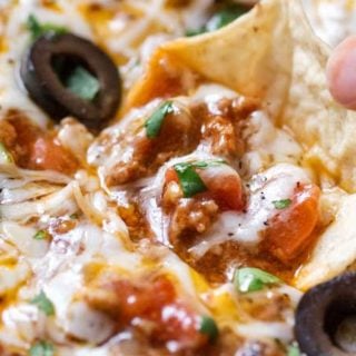 Ultimate Slow Cooker Taco Dip | This taco dip is party and game-day ready, and needs only 10 minutes of prep before going in your slow cooker! Great taco flavors, and you can easily swap out the beef for ground turkey to lighten it up! | The Chunky Chef | #tacodip #gamedayrecipes #partyfood #easyappetizer #appetizerrecipes
