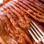 Fork showing the crispy sugar glaze on ham