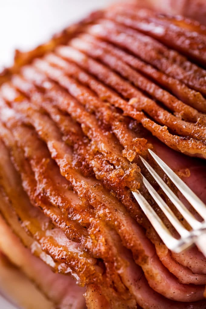 Fork showing the crispy sugar glaze on ham