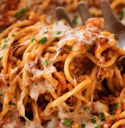 This Crockpot Spaghetti Casserole is every bit as tasty as it is easy!  Even the pasta cooks right in the slow cooker alongside the flavorful meat sauce, making this the ultimate weeknight meal! | #spaghetti #casserole #crockpot #slowcooker #Italianfood #weeknightmeal