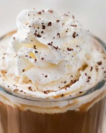 This Irish Coffee is made with black coffee, Irish whiskey, Baileys, brown sugar and heavy cream. Not 100% authentic, but 100% smooth and mouthwatering! | #coffee, #Irish, #StPatricksDay #irishcoffee #baileys #whiskey #boozycoffee