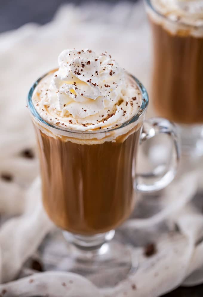 Irish Coffee is made with black coffee, Irish whiskey, Baileys, and brown sugar.  Classic Irish coffee, with an Irish cream twist – perfect for St. Patrick’s Day or an after dinner cocktail! #coffee, #Irish, #StPatricksDay #irishcoffee #baileys #whiskey #boozycoffee #cream #irishcream