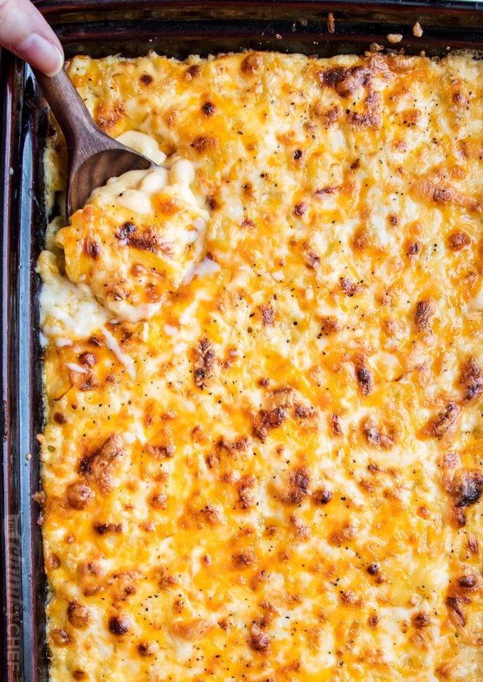 Rich and creamy homemade baked mac and cheese, filled with multiple layers of shredded cheeses, smothered in a smooth cheese sauce, and baked until bubbly and perfect! #macandcheese #comfortfood #macaroni #cheese #sidedish #comfortfood #holidayfood