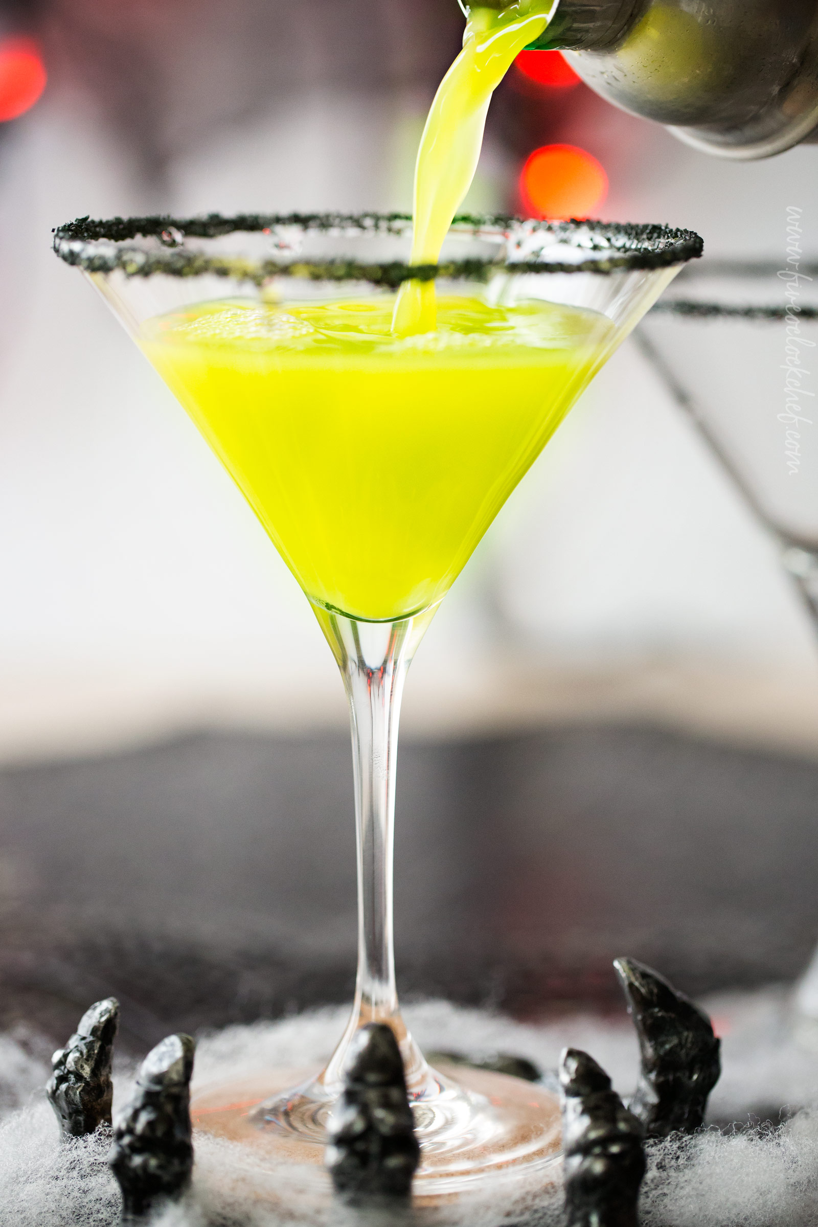 Witches Brew Halloween Cocktail | Sweet and mysterious, this Halloween cocktail practically glows with an eerie greenish color! Made with just 3 simple ingredients, it's a must make for any party! | https://www.the5oclockchef.com | #cocktail #halloween #witch #partydrink #midori