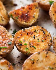 Yukon and red potatoes, seasoned with a fantastic homemade Greek seasoning blend, and roasted to crispy perfection! They're the ultimate side dish! | #roasted #potatoes #roastedpotatoes #Greek #sidedish