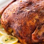 Making this homemade "rotisserie" chicken is as easy as 5 minutes of prep and a handful of spices.  Then sit back and let your slow cooker do all the work!  | #chicken #rotisseriechicken #slowcookerrecipe #crockpot #easyrecipe