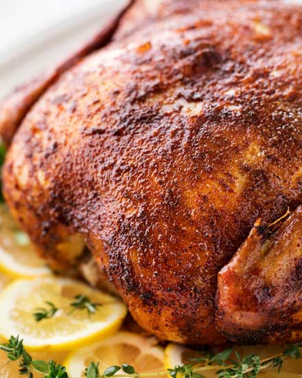 Making this homemade "rotisserie" chicken is as easy as 5 minutes of prep and a handful of spices.  Then sit back and let your slow cooker do all the work!  | #chicken #rotisseriechicken #slowcookerrecipe #crockpot #easyrecipe