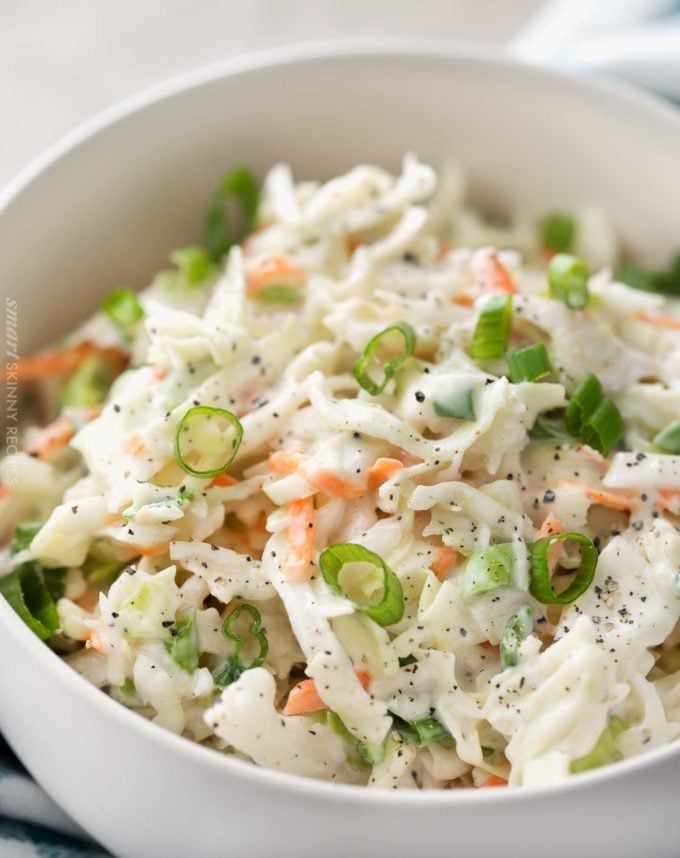 Creamy coleslaw in white bowl