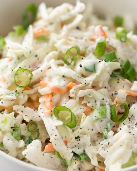 Tangy and sweet with plenty of crunch, this creamy coleslaw is lightened up to just 1 smart point per serving, and is the perfect side dish for your BBQ or potluck! | #coleslaw #potluck #cookout #summerbbq #skinnyrecipe #weightwatchers #freestyle #smartpoints