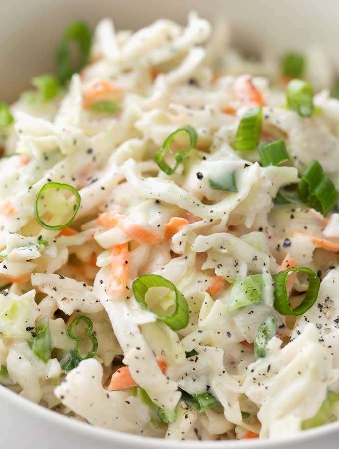 Tangy and sweet with plenty of crunch, this creamy coleslaw is lightened up to just 1 smart point per serving, and is the perfect side dish for your BBQ or potluck! | #coleslaw #potluck #cookout #summerbbq #skinnyrecipe #weightwatchers #freestyle #smartpoints