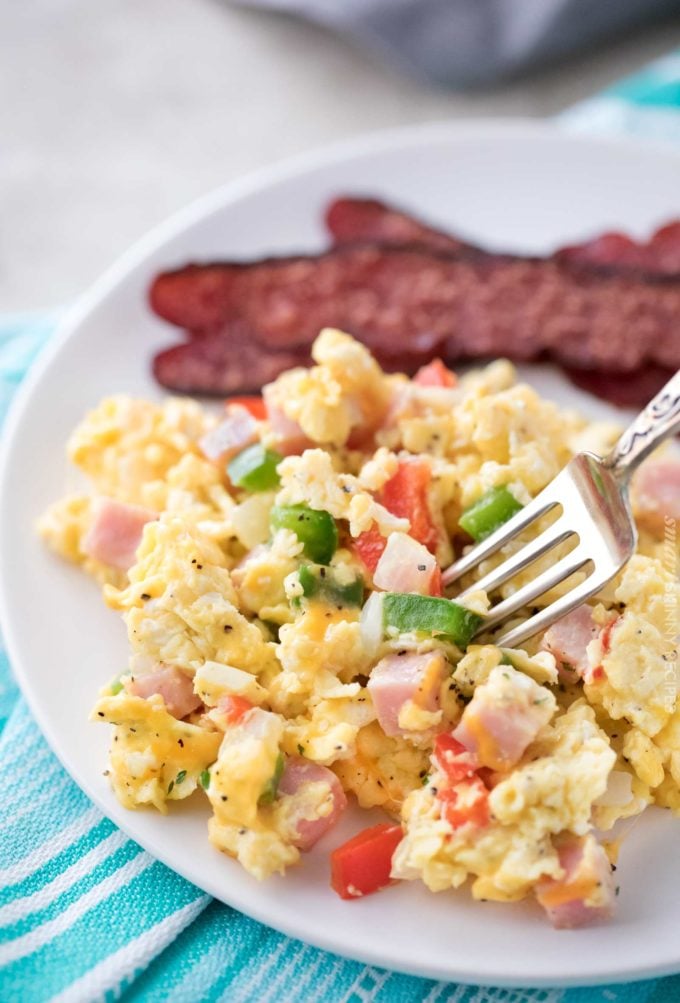 Plateful of scrambled eggs with bacon