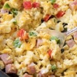 Perfectly fluffy scrambled eggs mixed with sautéed onion, peppers and diced ham, and topped with gooey cheddar cheese.  Perfect for breakfast, brunch or even brinner, and at only 3 weight watchers smart points, it's an amazingly healthy and nutritious recipe! | #weightwatchers #healthyrecipe #smartpoints #scrambledeggs #denveromelet