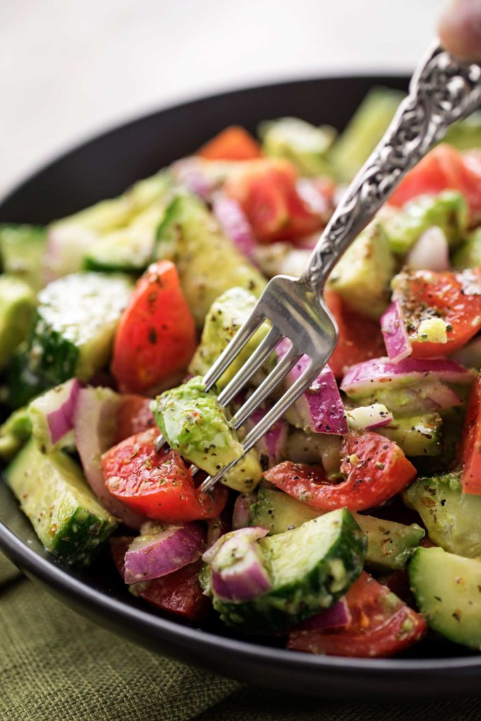 Forkful of tomato avocado salad