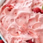 This make-ahead raspberry fluff jello salad dessert is made by using just a few ingredients and is perfect for potlucks and summer bbq's! | #jellosalad #dessertrecipe #fluff #raspberry #potluck
