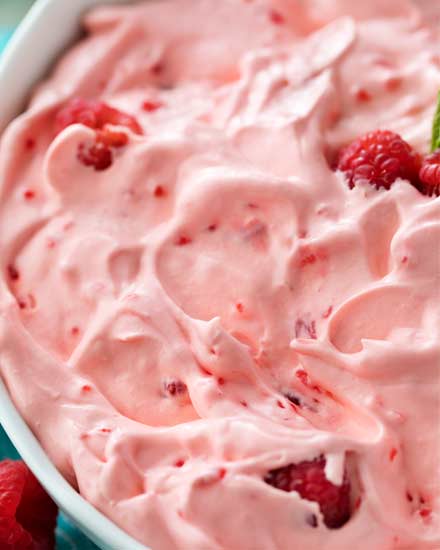 This make-ahead raspberry fluff jello salad dessert is made by using just a few ingredients and is perfect for potlucks and summer bbq's! | #jellosalad #dessertrecipe #fluff #raspberry #potluck