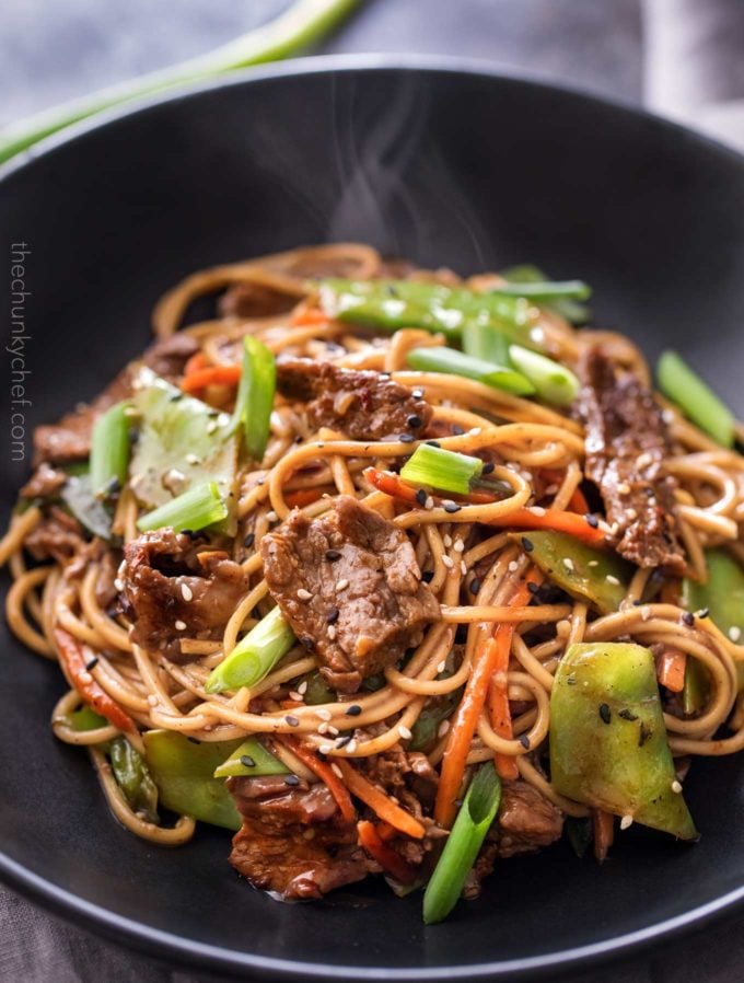 Serving of beef stir fry in black bowl