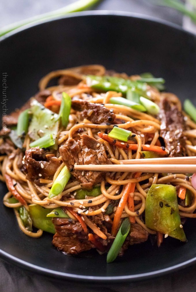 Stir fry with beef and vegetables with chopsticks