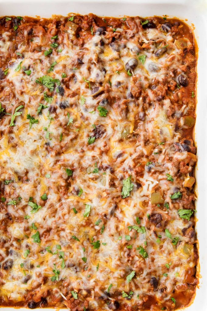 This beef and bean taco casserole is incredibly easy, made from scratch, freezer-friendly, and a huge hit families! 