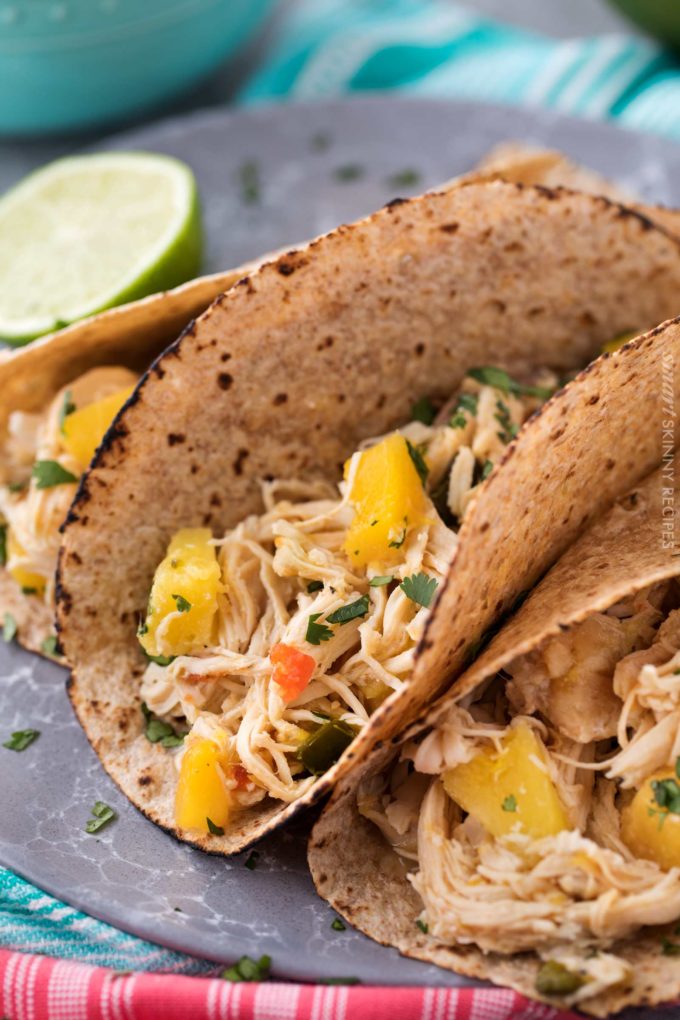 Tender, juicy, sweet and spicy crockpot chicken tacos, perfect for taco night!  Just 1 freestyle smart point per serving means you can have tacos without the guilt!