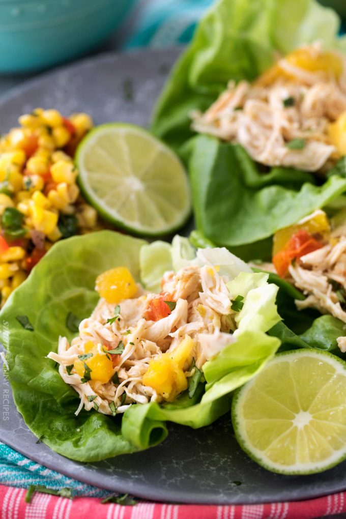 Tender, juicy, sweet and spicy crockpot chicken tacos, perfect for taco night!  Just 1 freestyle smart point per serving means you can have tacos without the guilt!