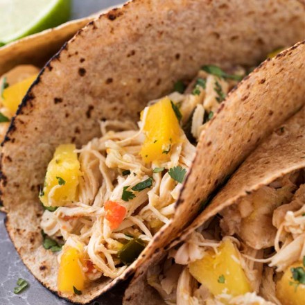 Tender, juicy, sweet and spicy crockpot chicken tacos, perfect for taco night!  Just 1 freestyle smart point per serving means you can have tacos without the guilt! | #chickentacos #tacotuesday #crockpot #slowcooker #weightwatchers