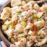This summertime staple is truly my FAVORITE potato salad recipe!  Plus tips on how to get the perfect potato texture, prevent a "wet" potato salad, and how to add extra zing that will make everyone want the recipe! | #potatosalad #potluckrecipe #summer #salad #sidedish #picnic