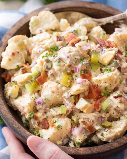 This summertime staple is truly my FAVORITE potato salad recipe!  Plus tips on how to get the perfect potato texture, prevent a "wet" potato salad, and how to add extra zing that will make everyone want the recipe! | #potatosalad #potluckrecipe #summer #salad #sidedish #picnic