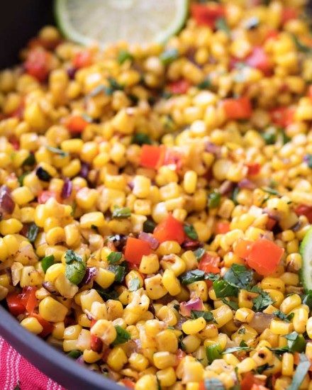 This Southwest cilantro lime corn salad is bold, healthy, and incredibly versatile!  At zero smart points per serving, feel free to pile it on tacos for an amazing meal! | #cornsalad #mexican #southwest #cilantro #lime #tacotuesday