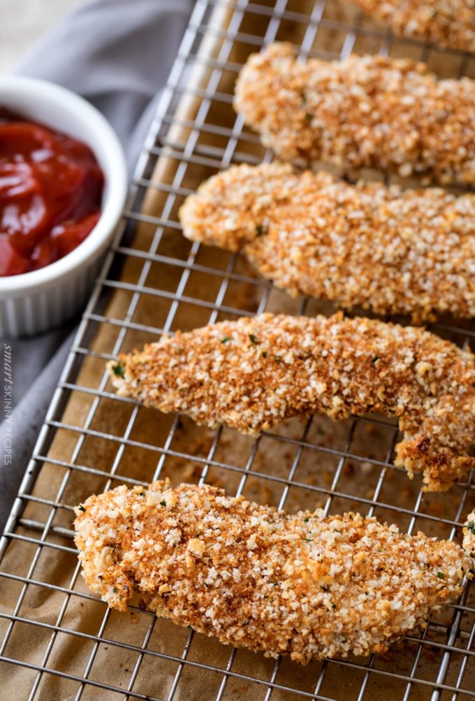 Baked chicken tenders on baking sheet