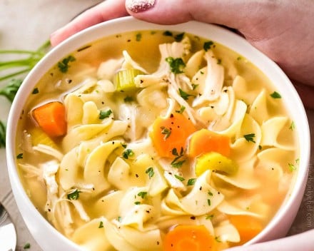 Guaranteed to warm you from the inside out, this homemade chicken noodle soup is made in the crockpot for an ultra-easy home-cooked meal that will feed your soul! #chickennoodlesoup #crockpotrecipe #slowcookermeal #chickennoodle #souprecipe #chickensoup