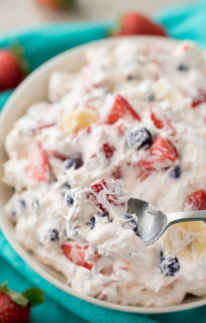 Spoonful of cheesecake salad with mixed berries