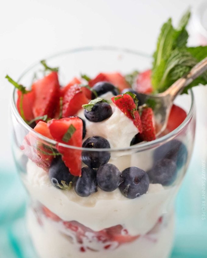 Spoonful of berry parfait with strawberries and blueberries