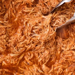 Incredible pulled BBQ chicken made easy in the crockpot... made from scratch with no bottled bbq sauce! Perfect for a summer bbq or picnic! | #bbqchicken #pulledchicken #crockpotchicken #weightwatchers #freestyle #smartpoints