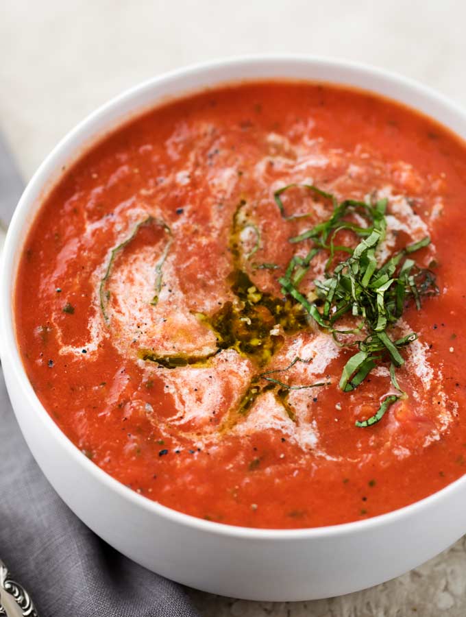 This tomato basil soup takes only 15 minutes to make, yet is positively bursting with flavors you'd expect from a soup that's been simmering all day!